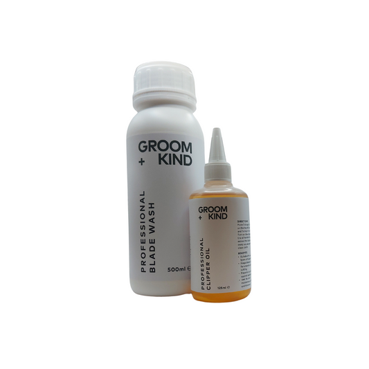 Bottles of Groom + Kind Blade Wash and Clipper Oil on a white background.
