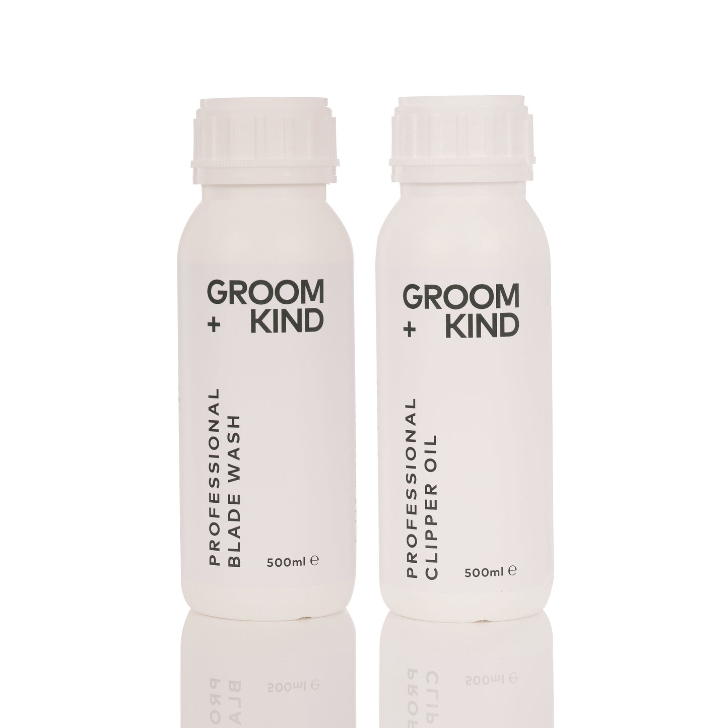 Two bottles of Groom + Kind Clipper Oil and Blade Wash products on a white background.
