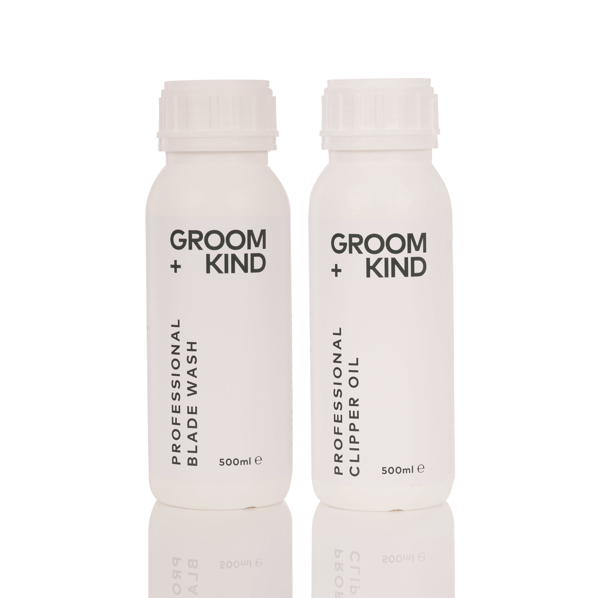 Two bottles of Groom + Kind Clipper Oil and Blade Wash products on a white background.