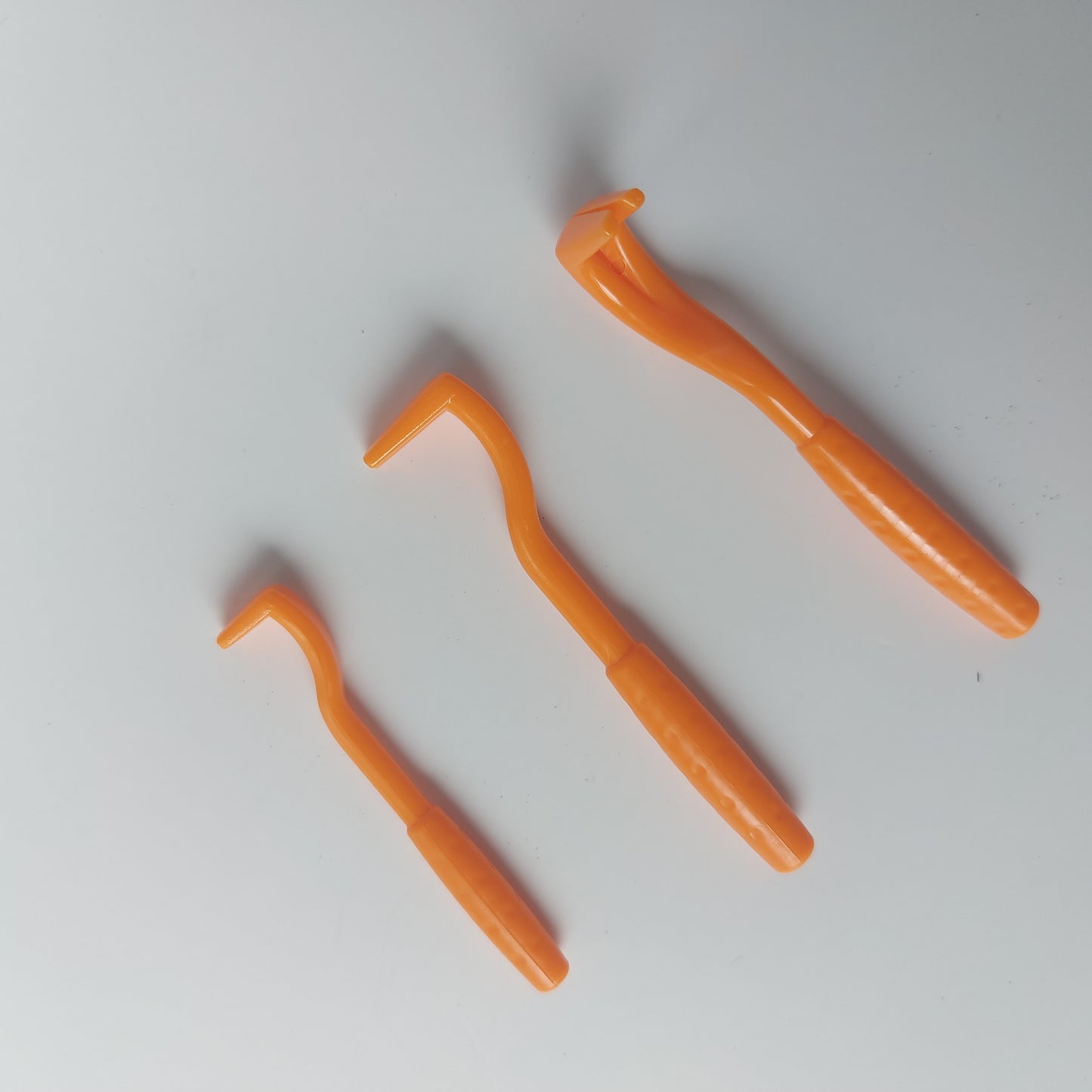 Gentle, twist-lift action for safe tick detachment.