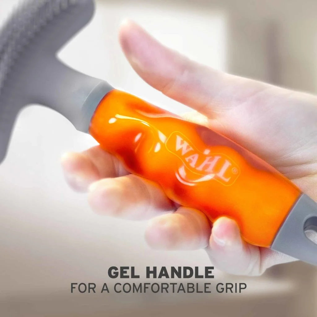 Person showing the comfortable grip on the handle of the double row rake and grooming blade