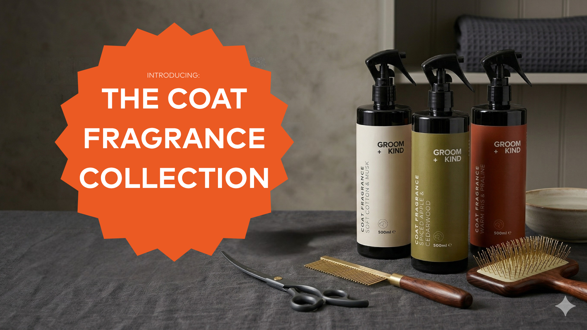 Three bottles of Groom + Kind Coat Fragrance and Dog Cologne on a grooming table