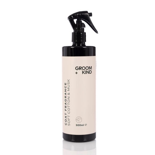 A 500ml bottle of Groom + Kind coat fragrance on a white background